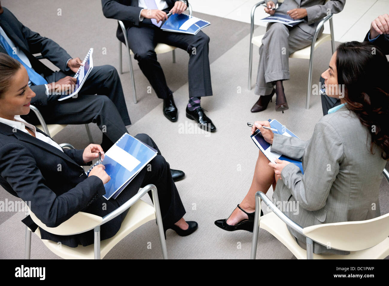 High angle view of business people meeting in circle Stock Photo