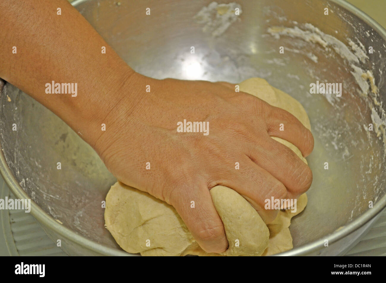 Indian woman kneading dough Stock Photo Alamy