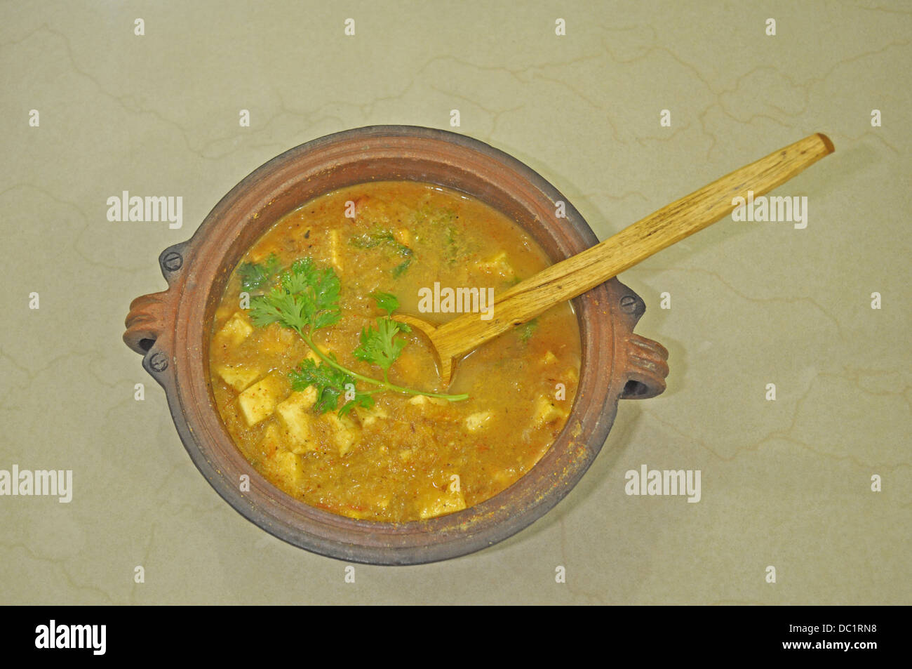 Paneer (Indian cheese) curry in an earthen pot Stock Photo