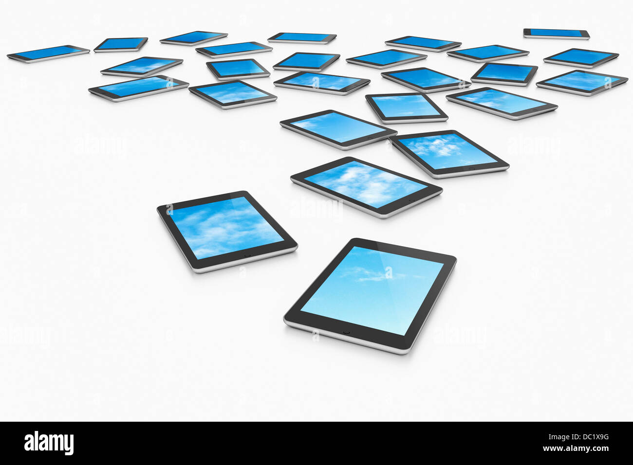 Large group of digital tablets displaying choice of blue skies Stock