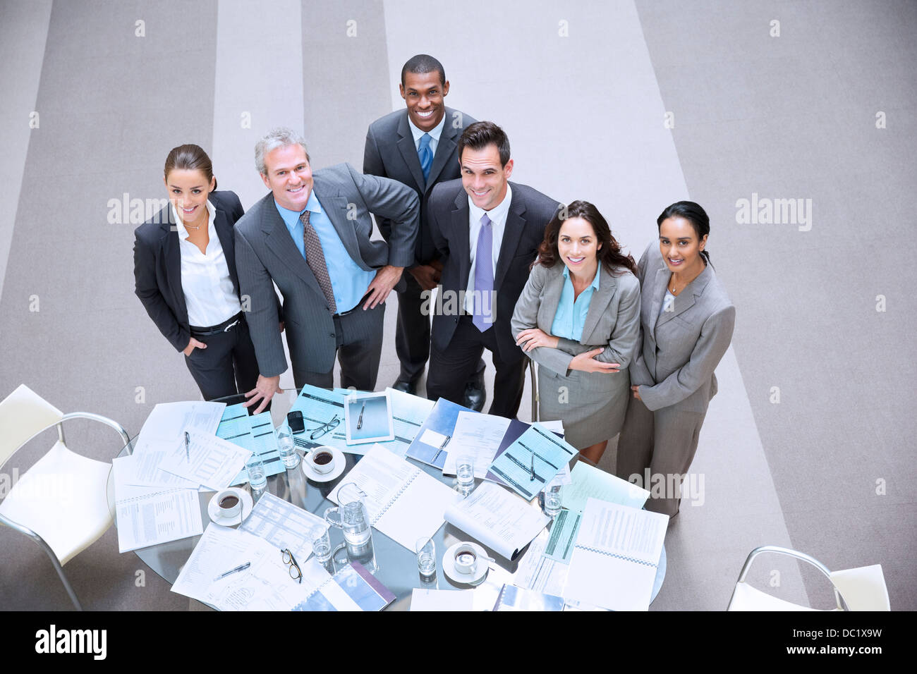 High angle portrait of smiling business people at table Stock Photo - Alamy