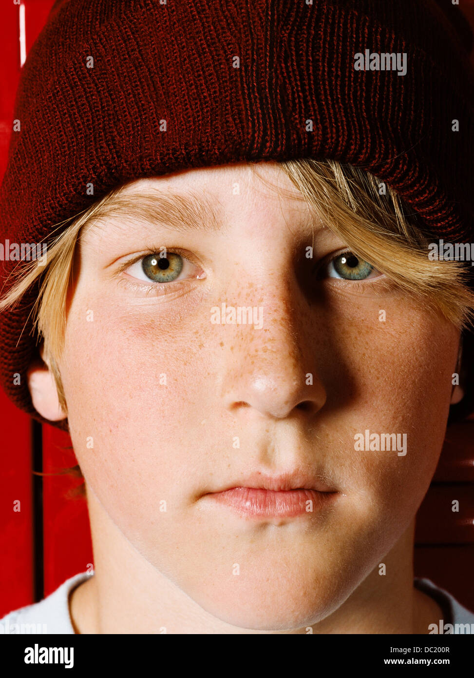 Boy wearing knit hat in school locker room, portrait Stock Photo