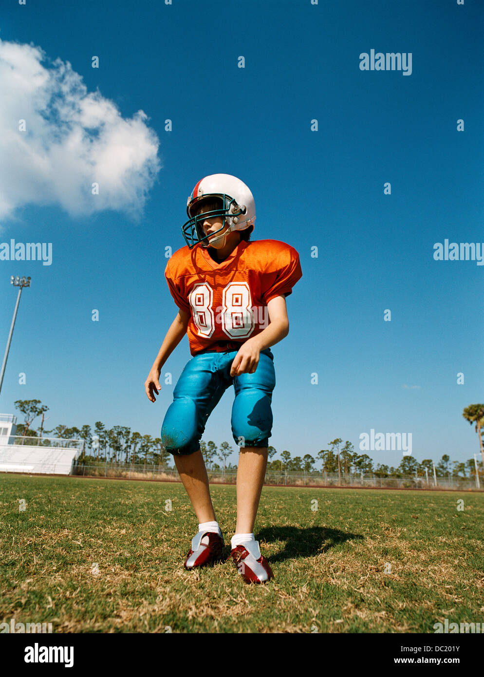 Boy playing American football Stock Photo