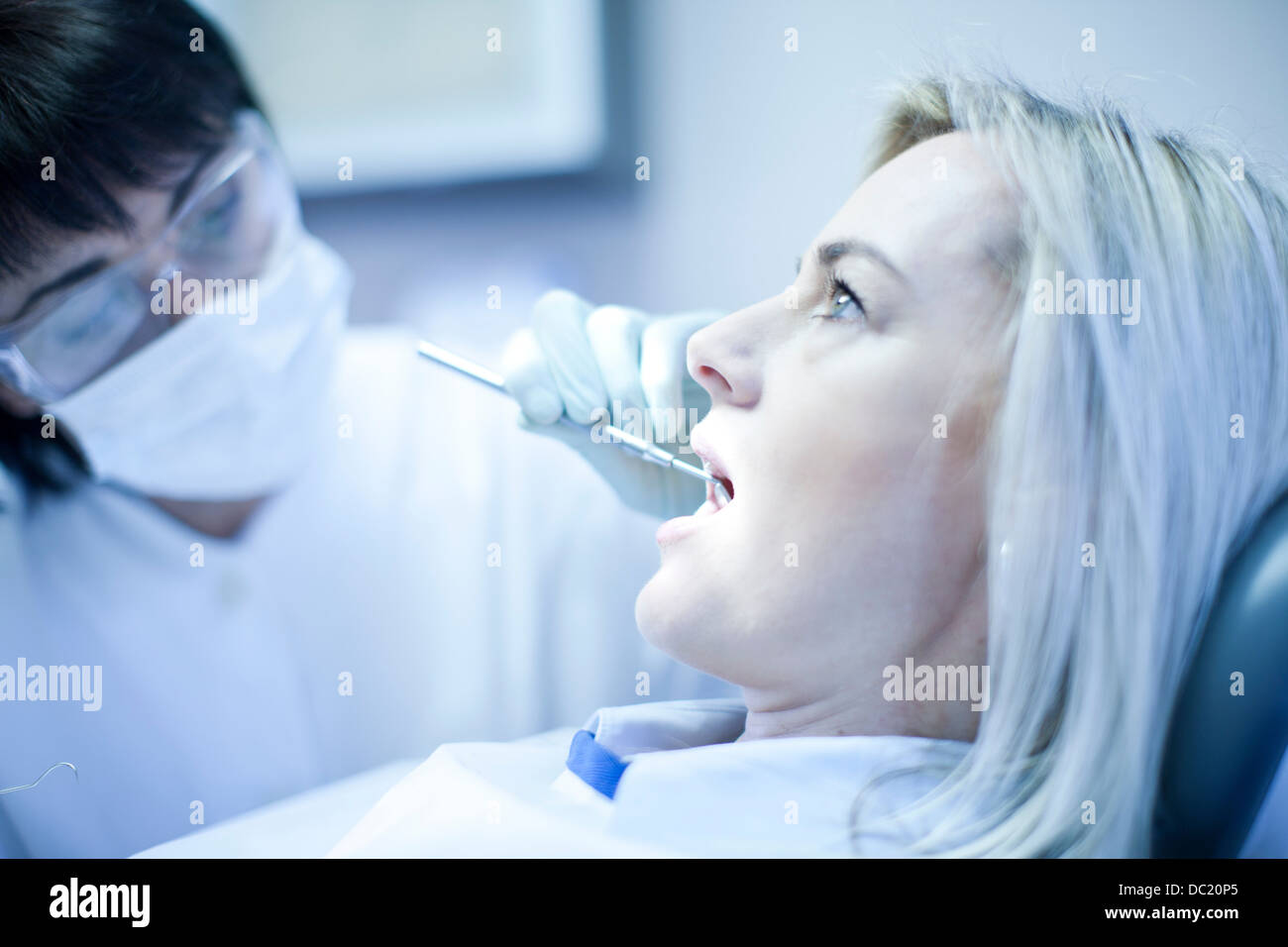 Close up of dentist checking patients teeth Stock Photo Alamy