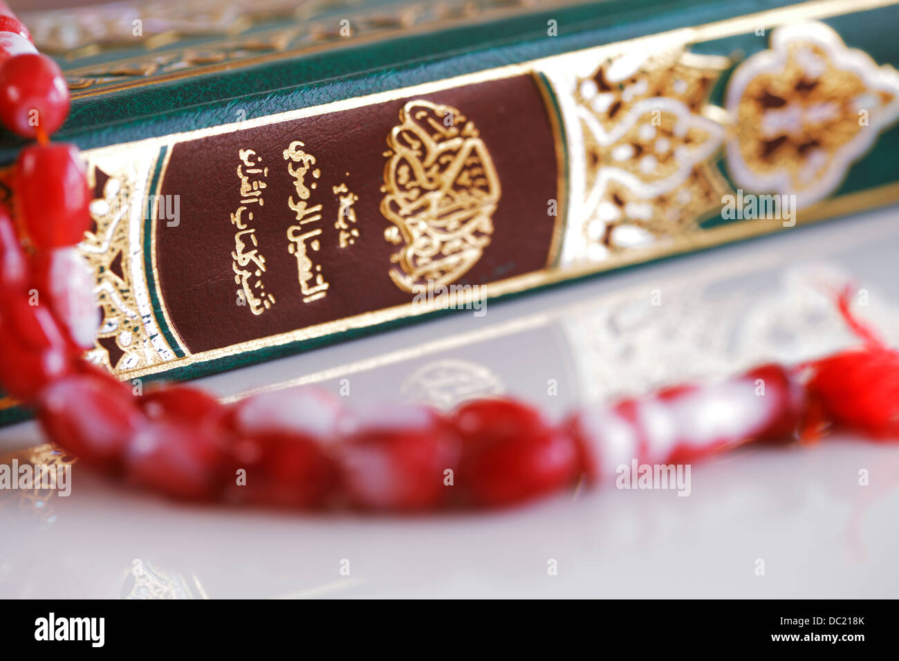 The Masbaha is also known as Tasbih is a string of prayer beads which is traditionally used by Muslims along with the Quran Stock Photo