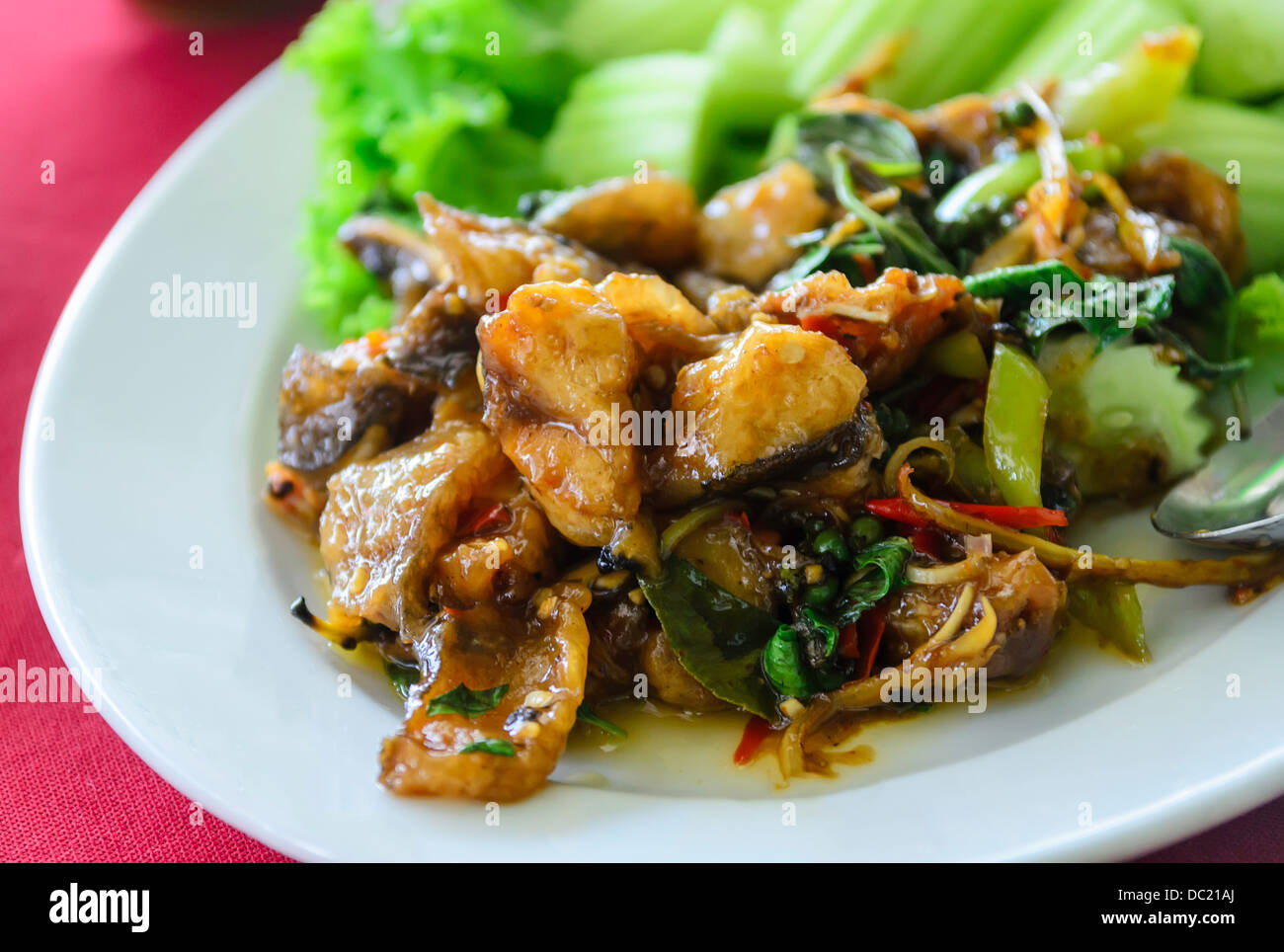 Fried spicy fish for sale in a restaurant Stock Photo