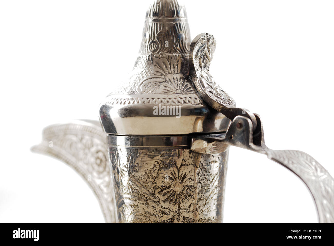 An ornate dallah which is a metal pot with a long spout designed specifically for making Arabic coffee Stock Photo