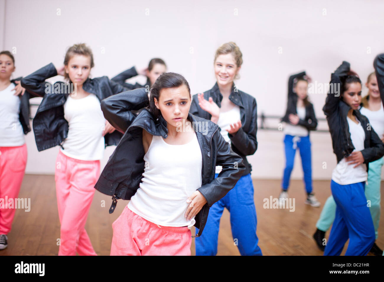 Group of teenagers practicing dance in studio Stock Photo