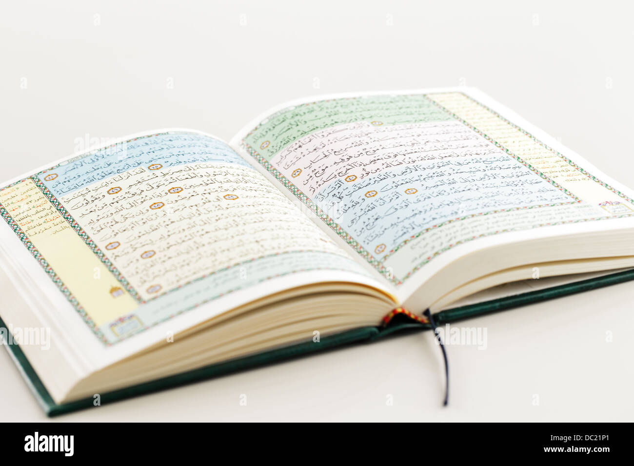 The Quran literally meaning 'the recitation' is the central religious text of Islam Stock Photo