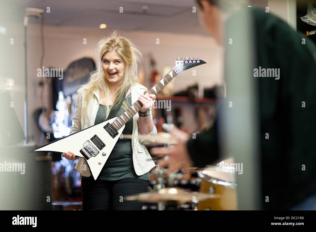 Young couple in music store Stock Photo