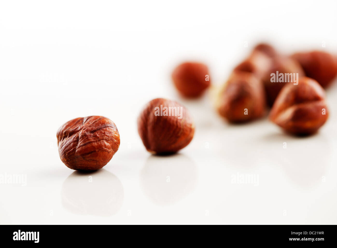 A handful of hazelnuts on a white background Stock Photo