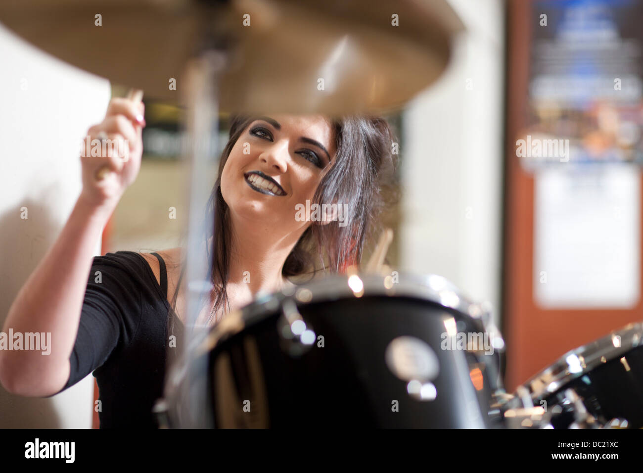 Drummer sitting at drum kit hi-res stock photography and images - Alamy
