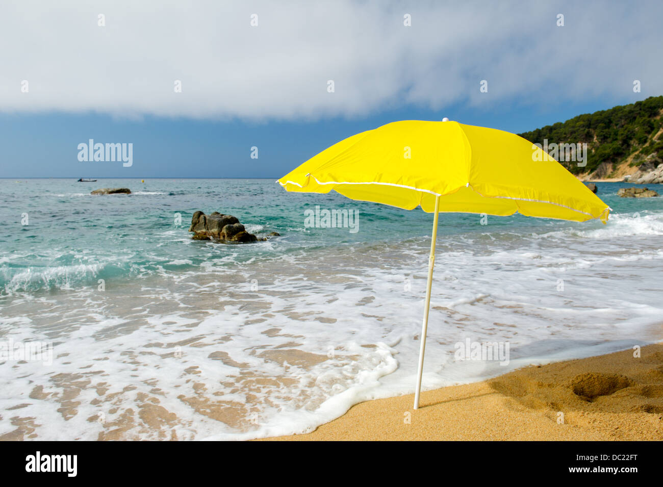 yellow parasol at the summer beach Stock Photo - Alamy