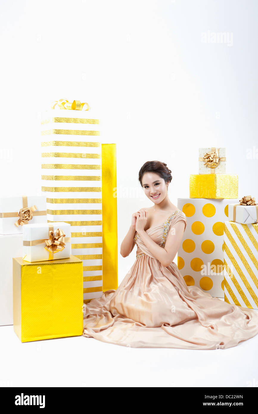 A Woman In Fancy Dress Sitting On The Floor With Many