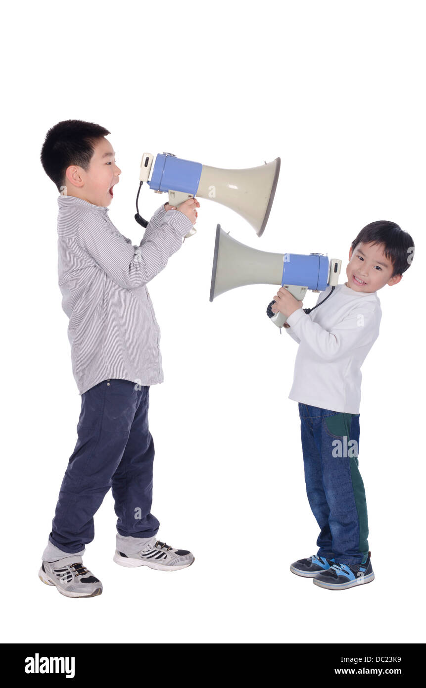 Two children yell at megaphone Stock Photo