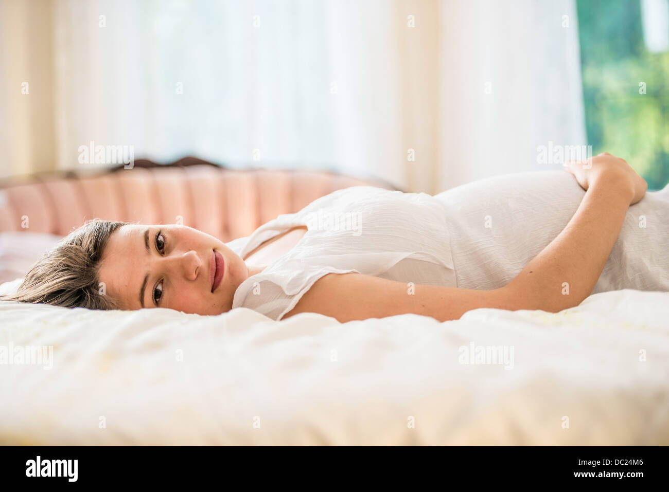 Pregnant woman lying on back Stock Photo
