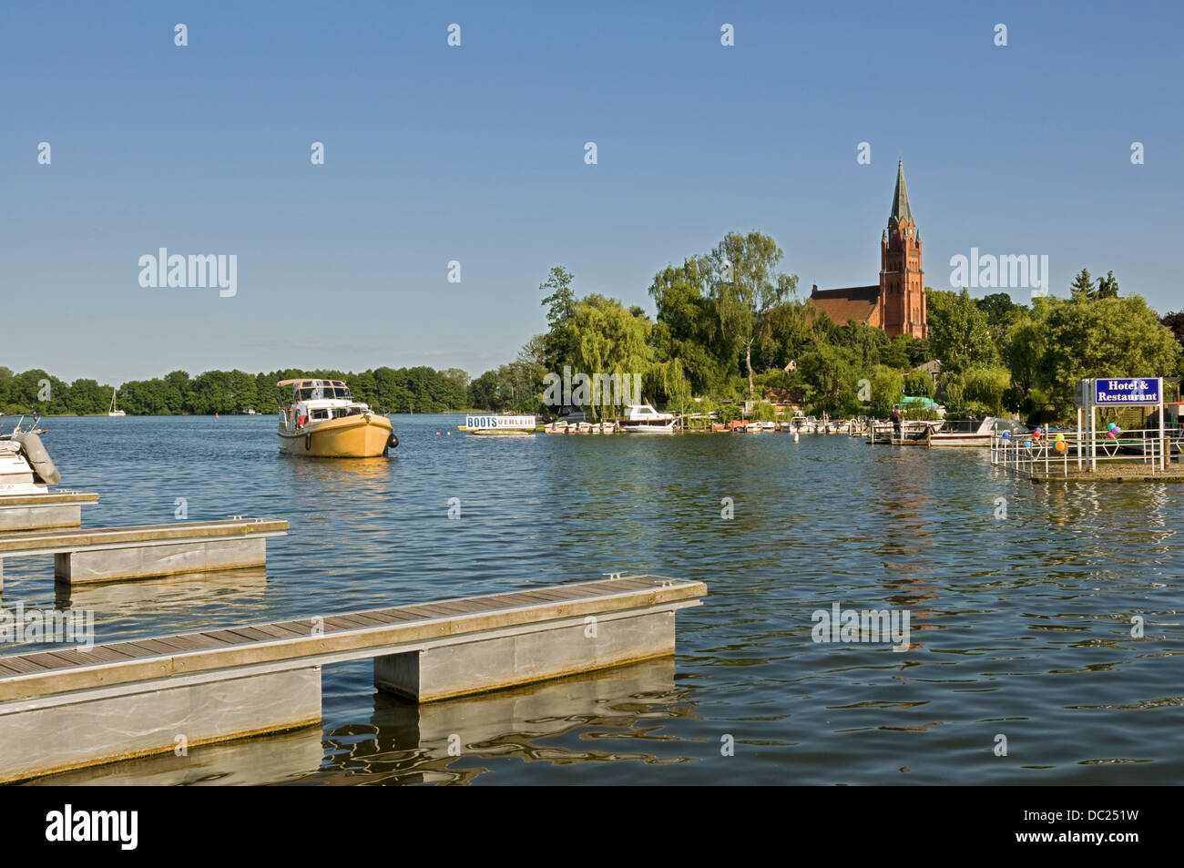View over part of Müritz Lake to St. Marys church in Röbel, Mecklenburg, Germany Stock Photo