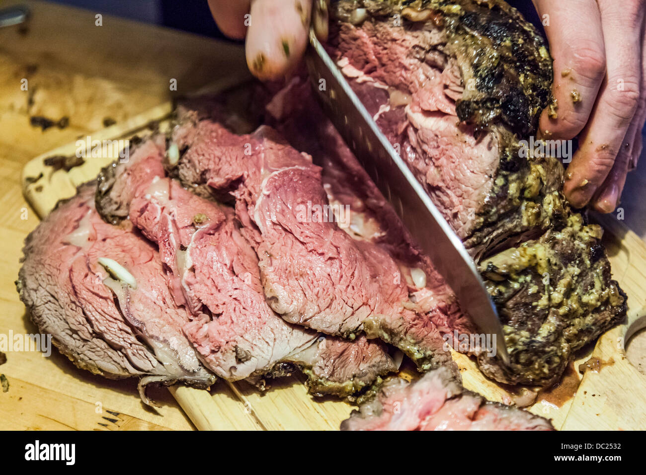 Broiled and grilled leg of lamb cooked rare and sliced Stock Photo Alamy