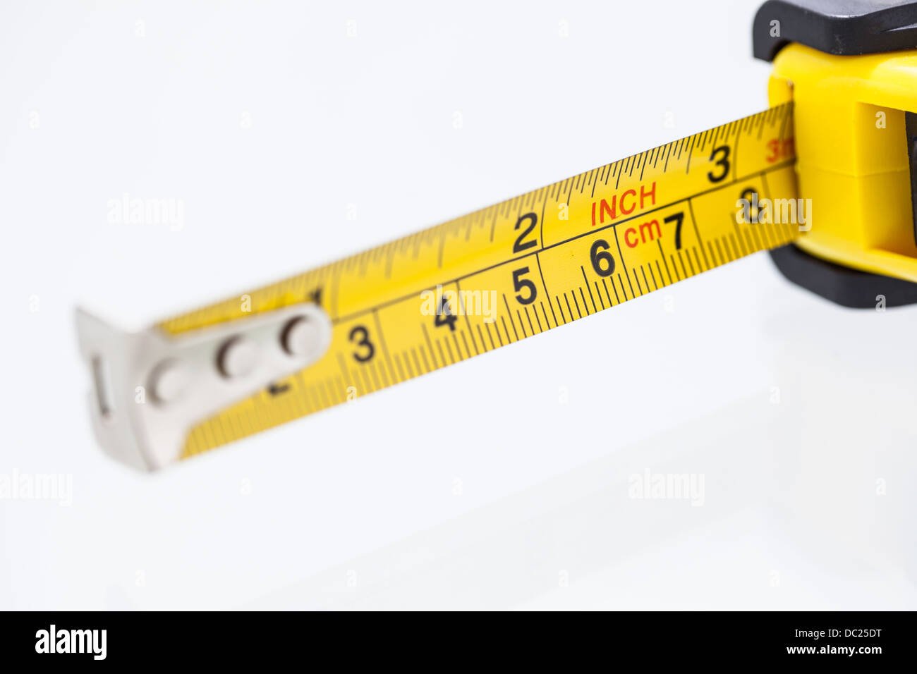Measurement tool on white background, focus on inch and cm Stock Photo ...