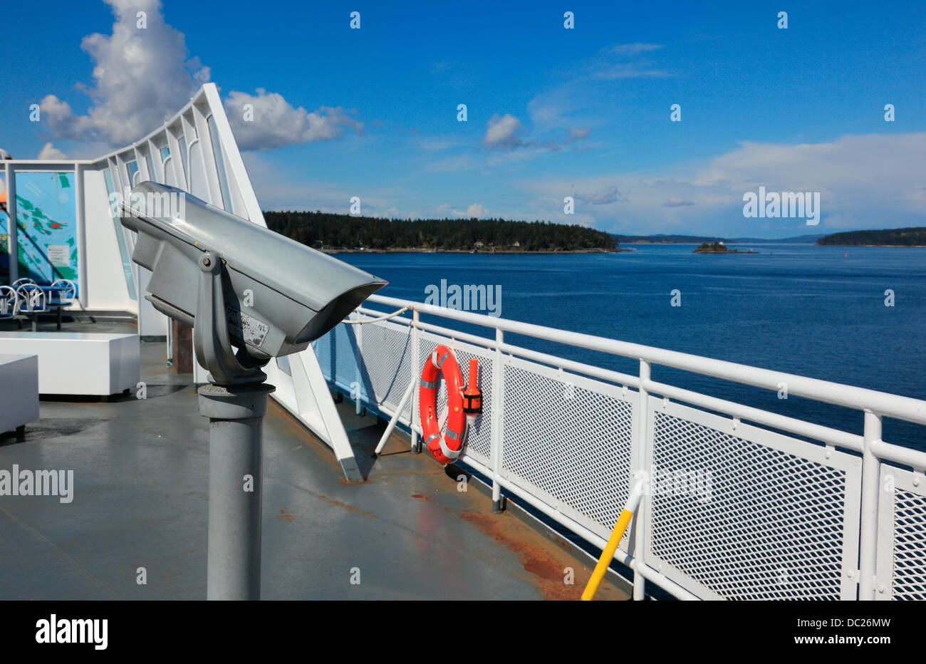 Ferry from Vancouver Island,  British Columbia Canada. Lookout telescope on deck of boat in the strait of georgia heading to Van Stock Photo