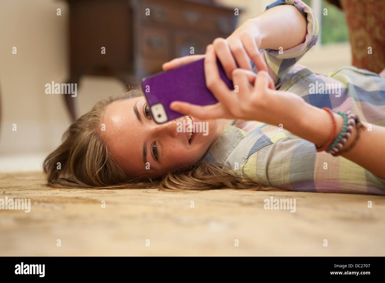 Brunette girl lying on floor hi-res stock photography and images - Alamy