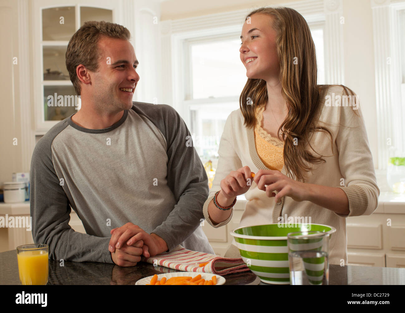 Brother and sister preparing food Stock Photo