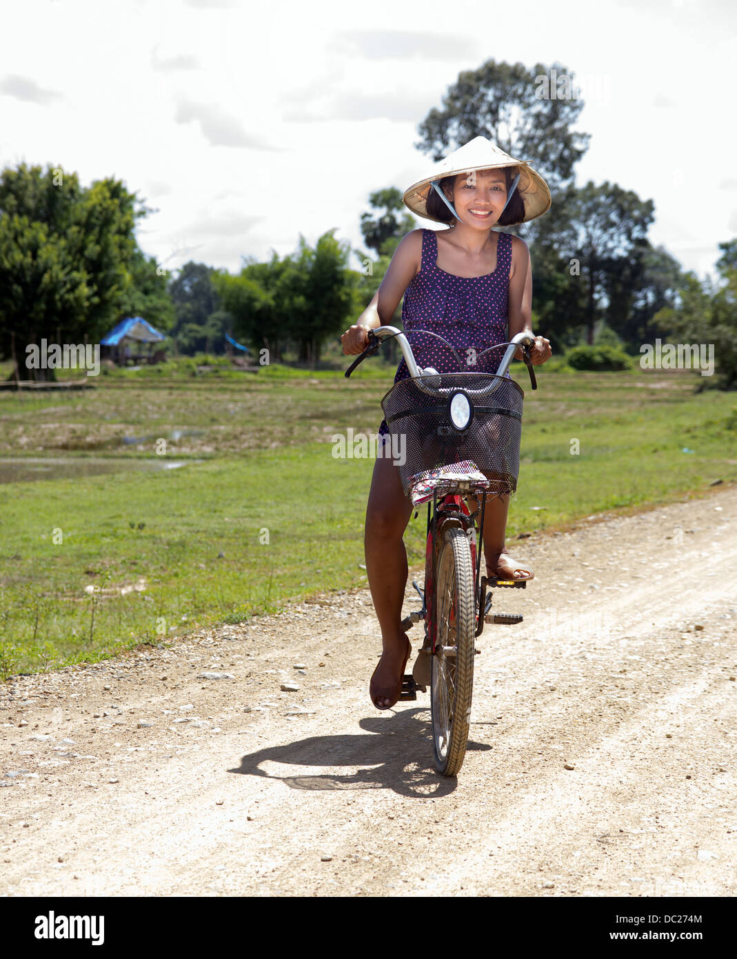 happy girl goes on a bicycle Stock Photo