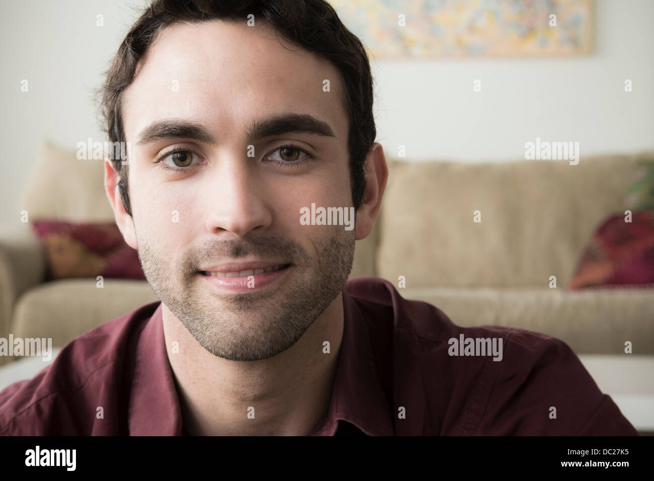 Portrait of young man with black hair Stock Photo