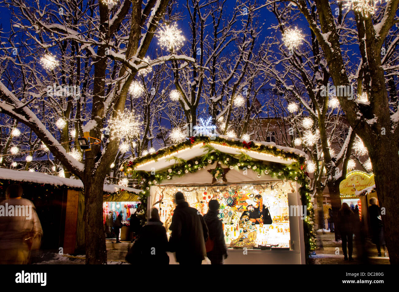 Switzerland, Basel. Munsterplatz Winter Holiday Market. Holiday lights on a winter night at the Musterplatz market. Stock Photo