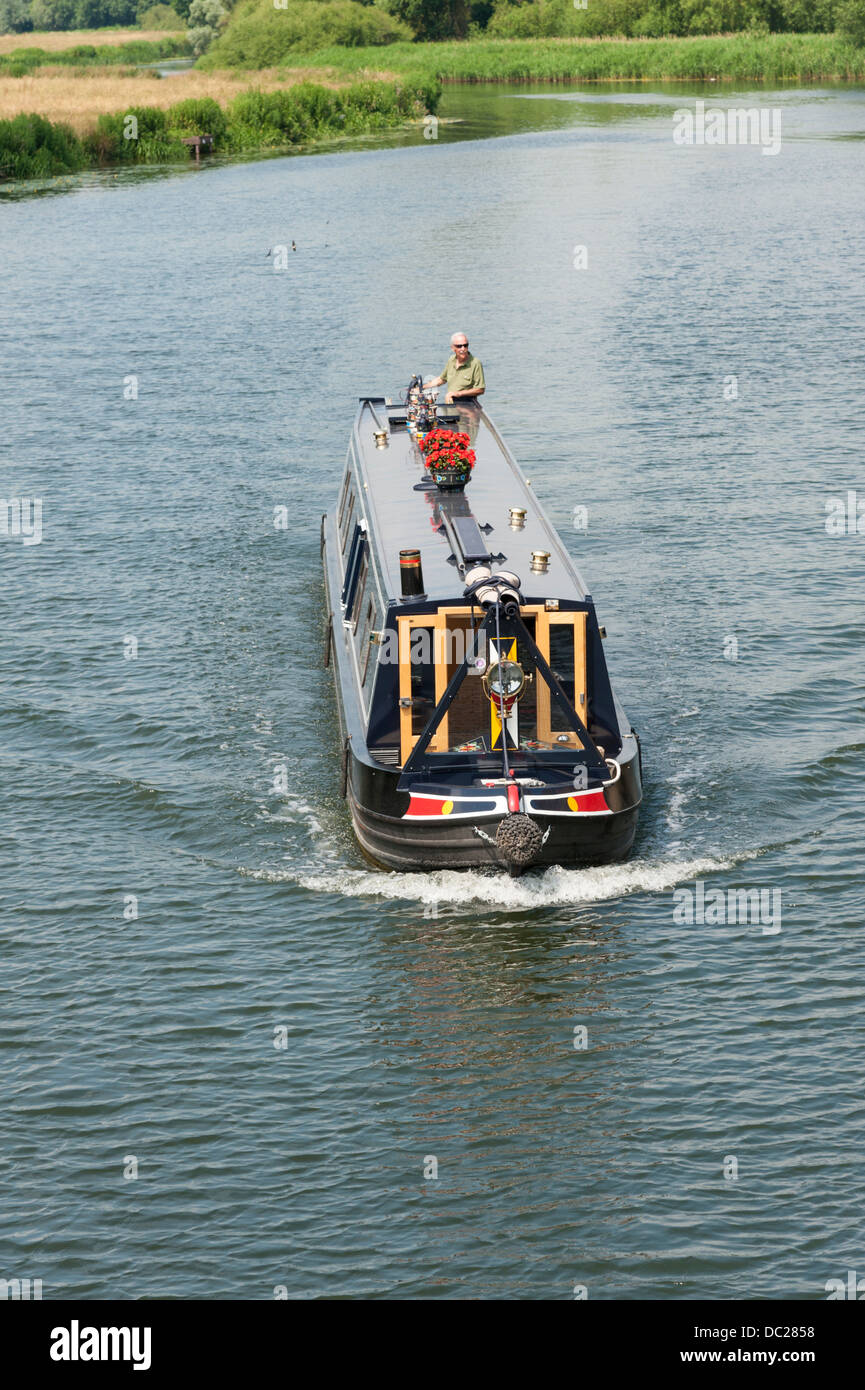A narrowboat or longboat on the River Great Ouse St Ives Cambridgeshire