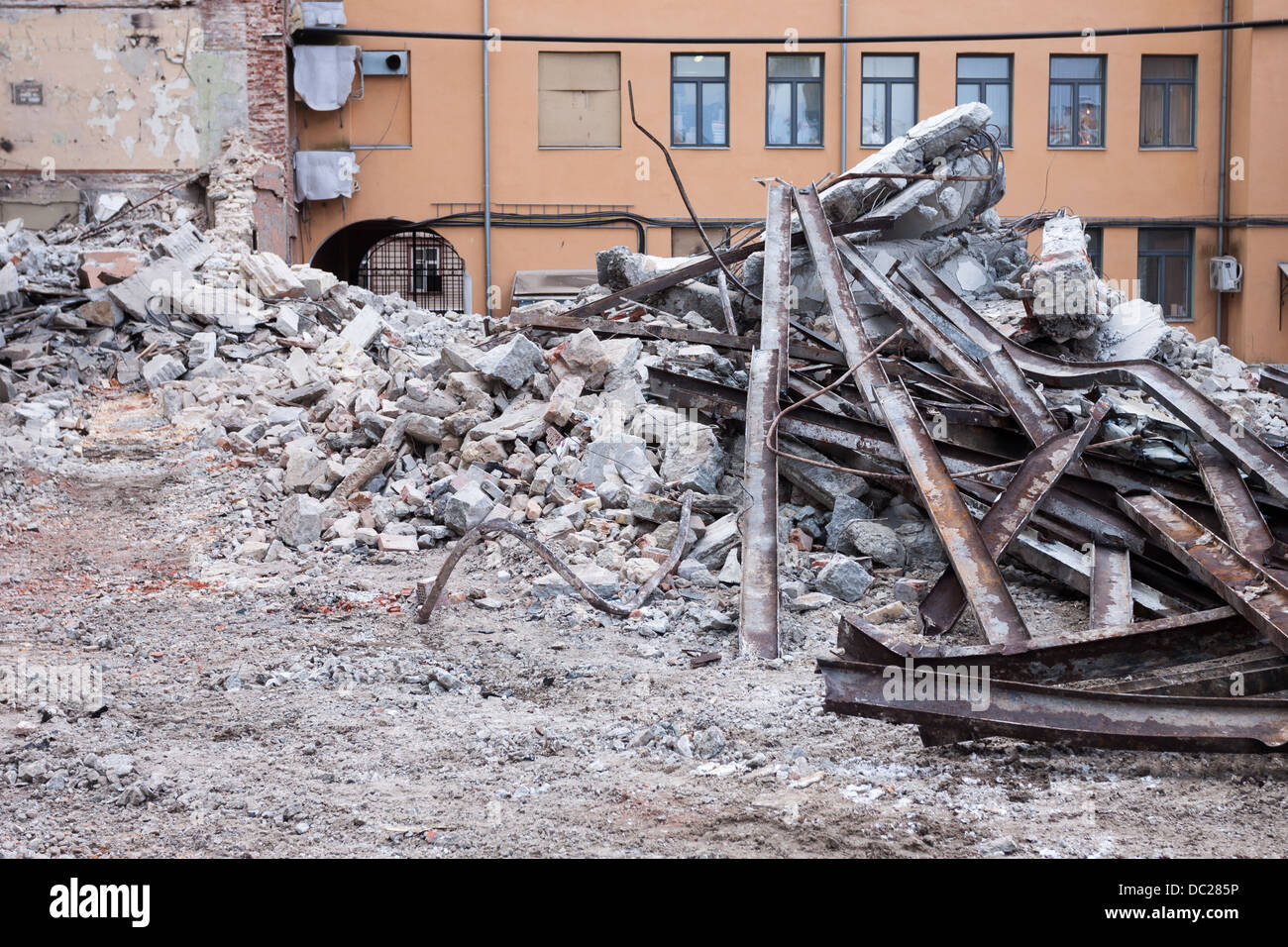 heap of rubble and a demolished building in the background Stock Photo ...