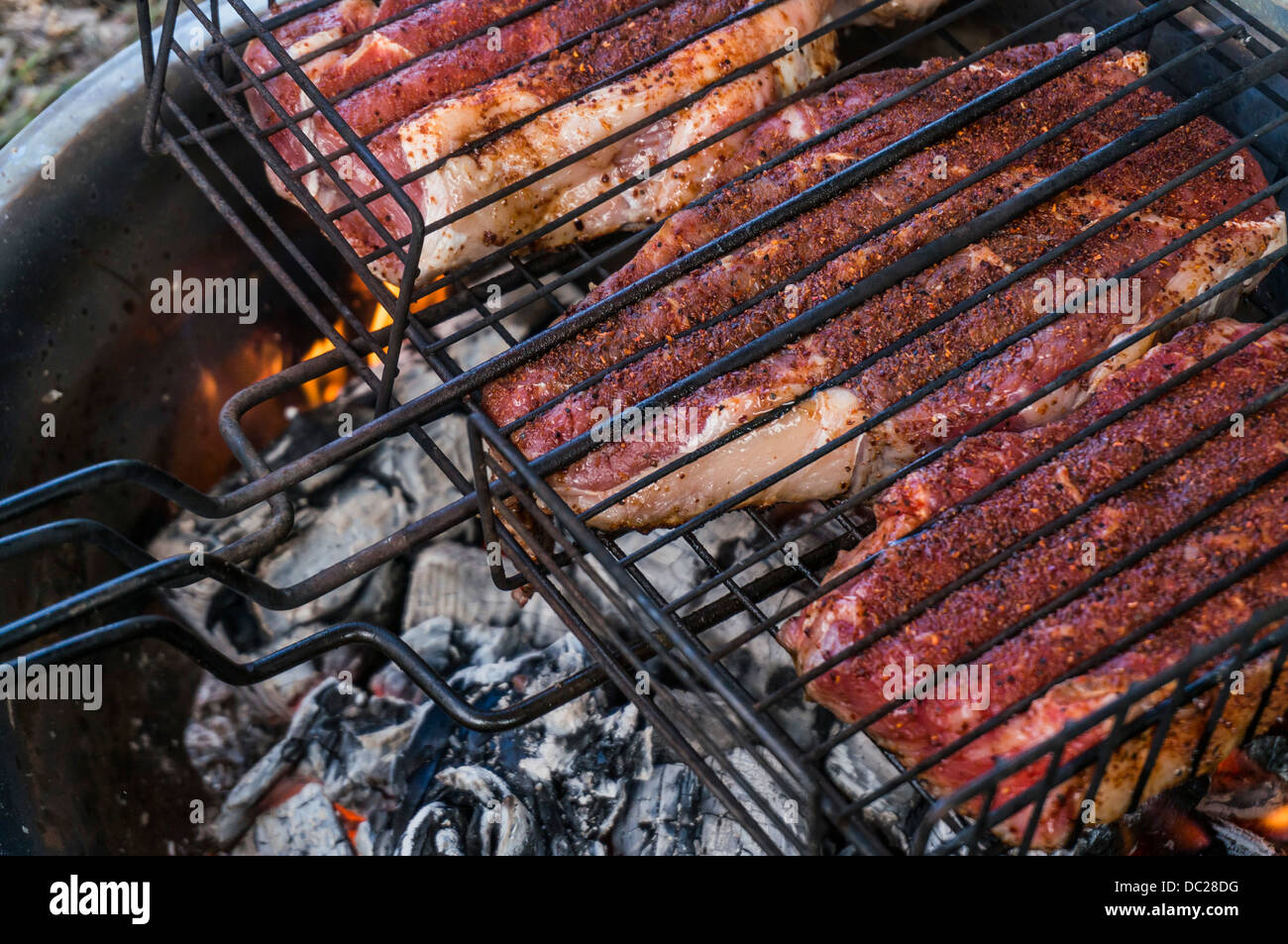 Ribeye steaks grilling on a wood campfire Stock Photo Alamy