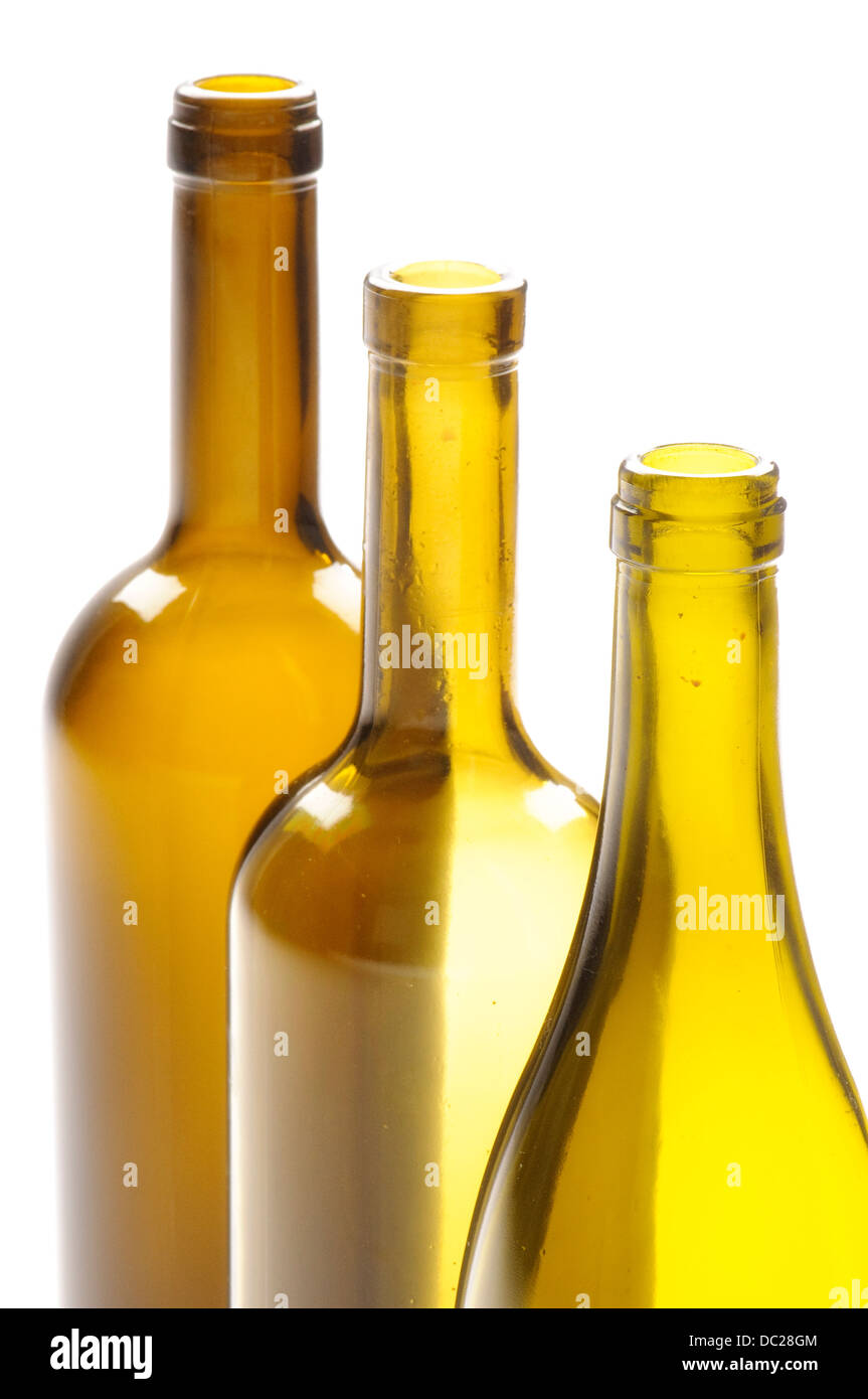 Three empty yellow glass wine bottles on white background Stock Photo ...