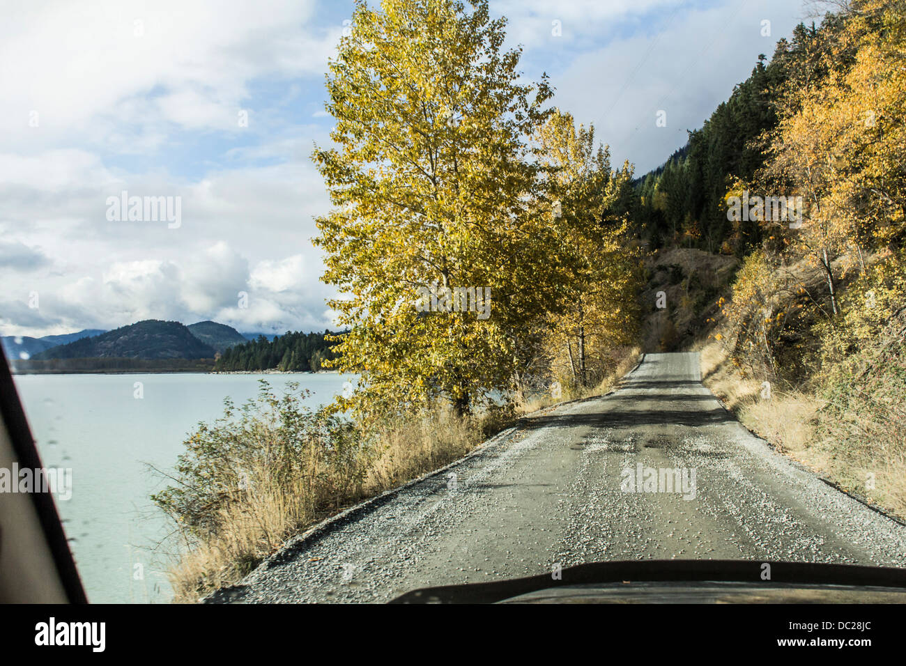 Lillouette Lake Road seen through the windshield in Autumn, near Lillouette BC, Canada. Stock Photo