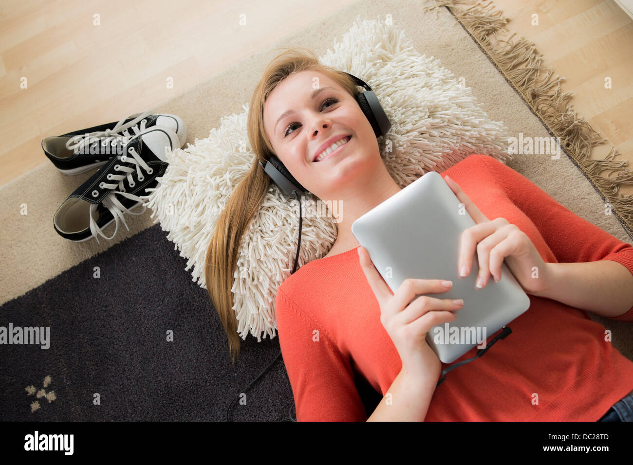 Teenage girl wearing headphones with digital tablet Stock Photo