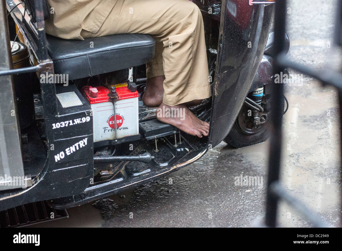 Autorickshaw tuktuk driver feet battery detail taxi Stock Photo