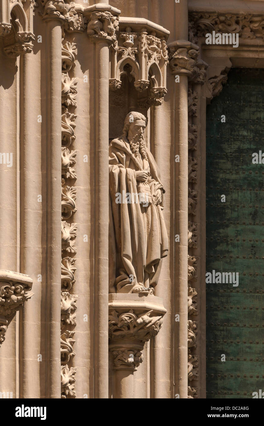 Statue of Saint Jude Thaddeus in a niche near a gate of the cathedral, Seville, Spain. Stock Photo