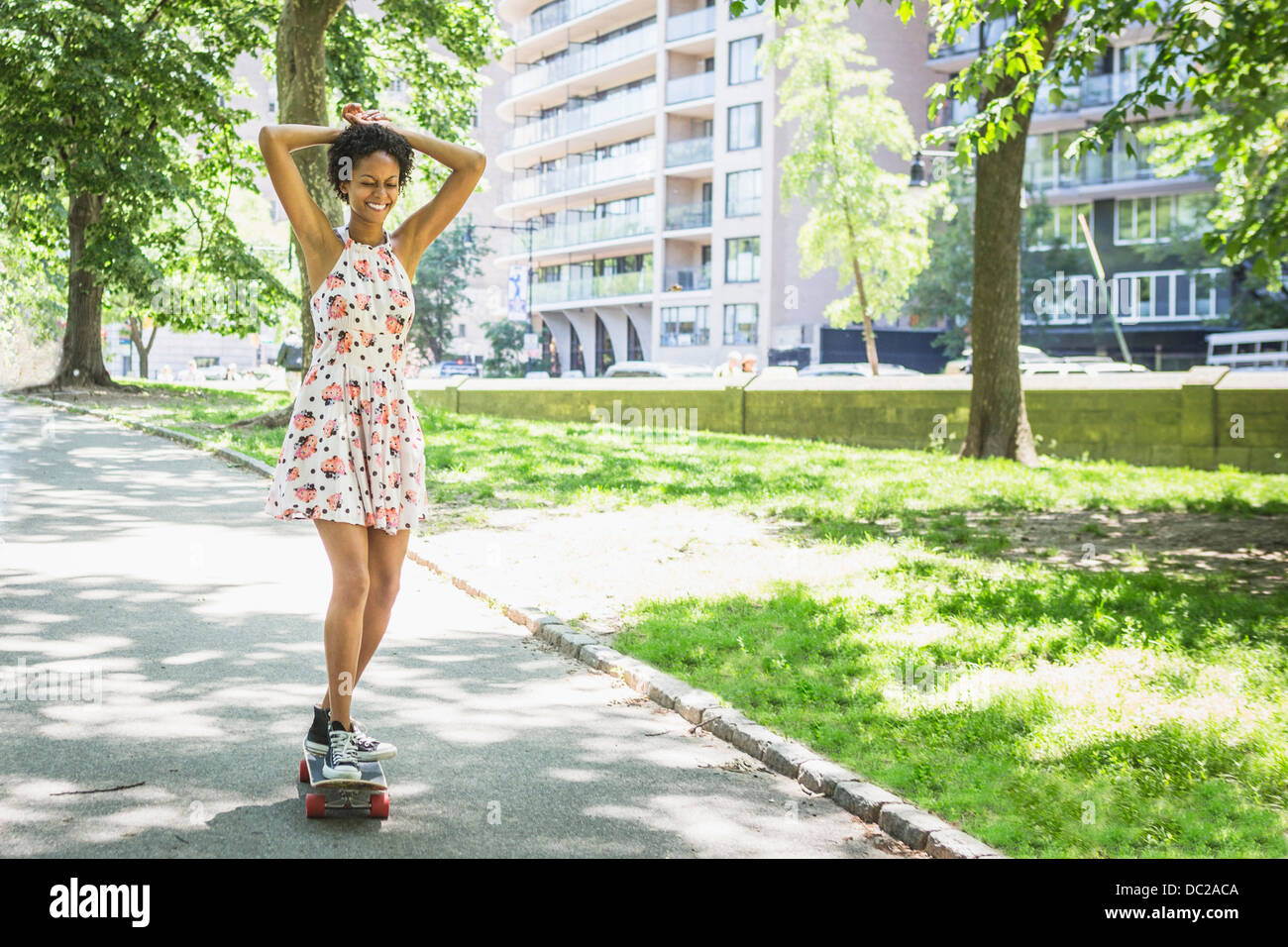 Woman skateboarding Stock Photo