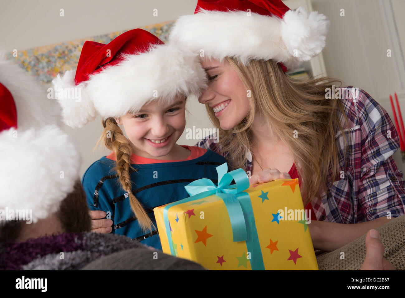 Girl looking at christmas gift Stock Photo
