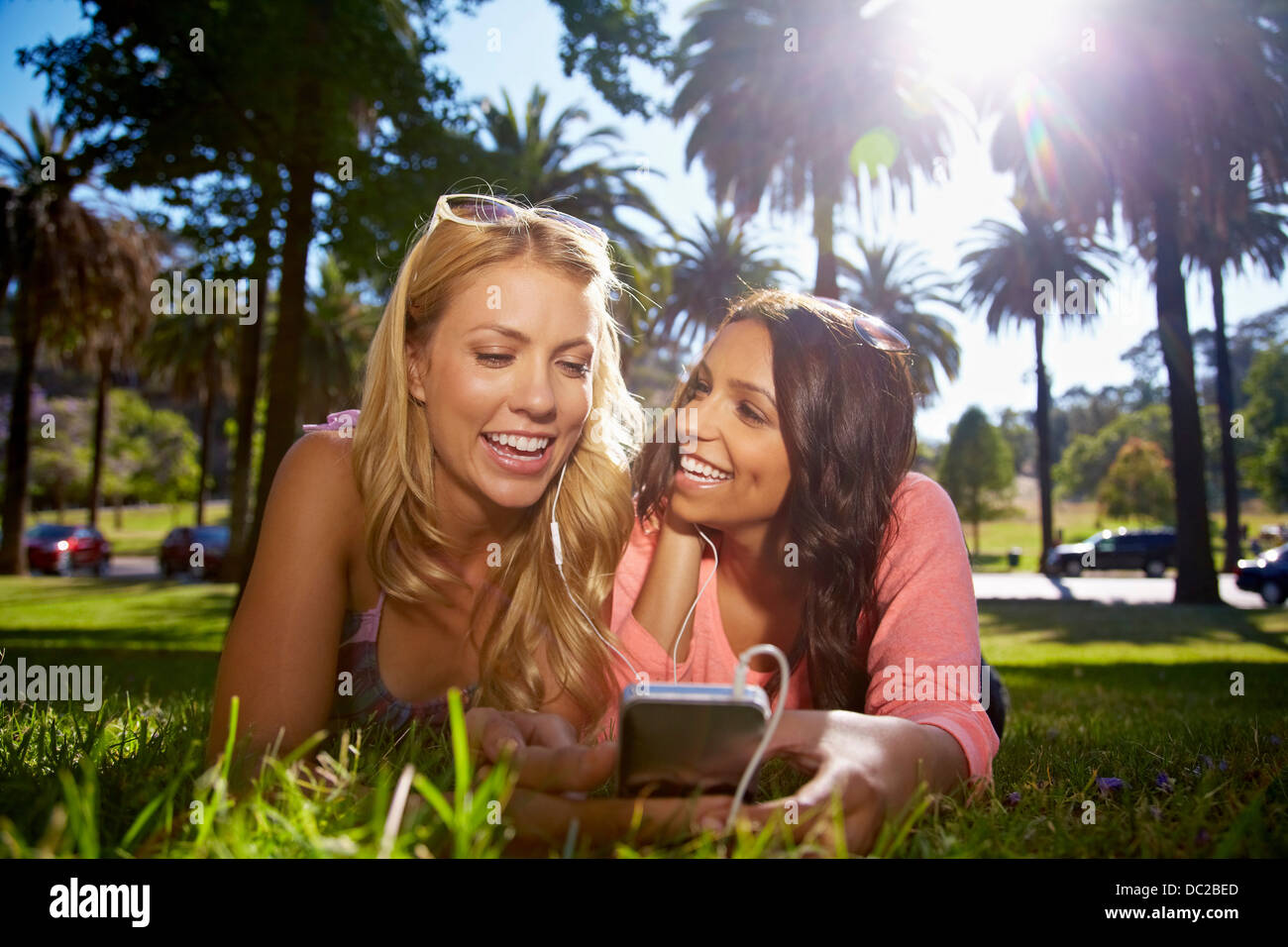 Women sharing text message on phone Stock Photo