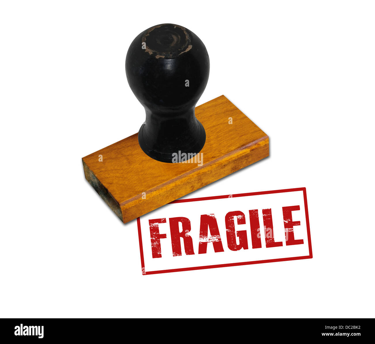 An office rubber stamp with text "FRAGILE" punched in red Stock Photo