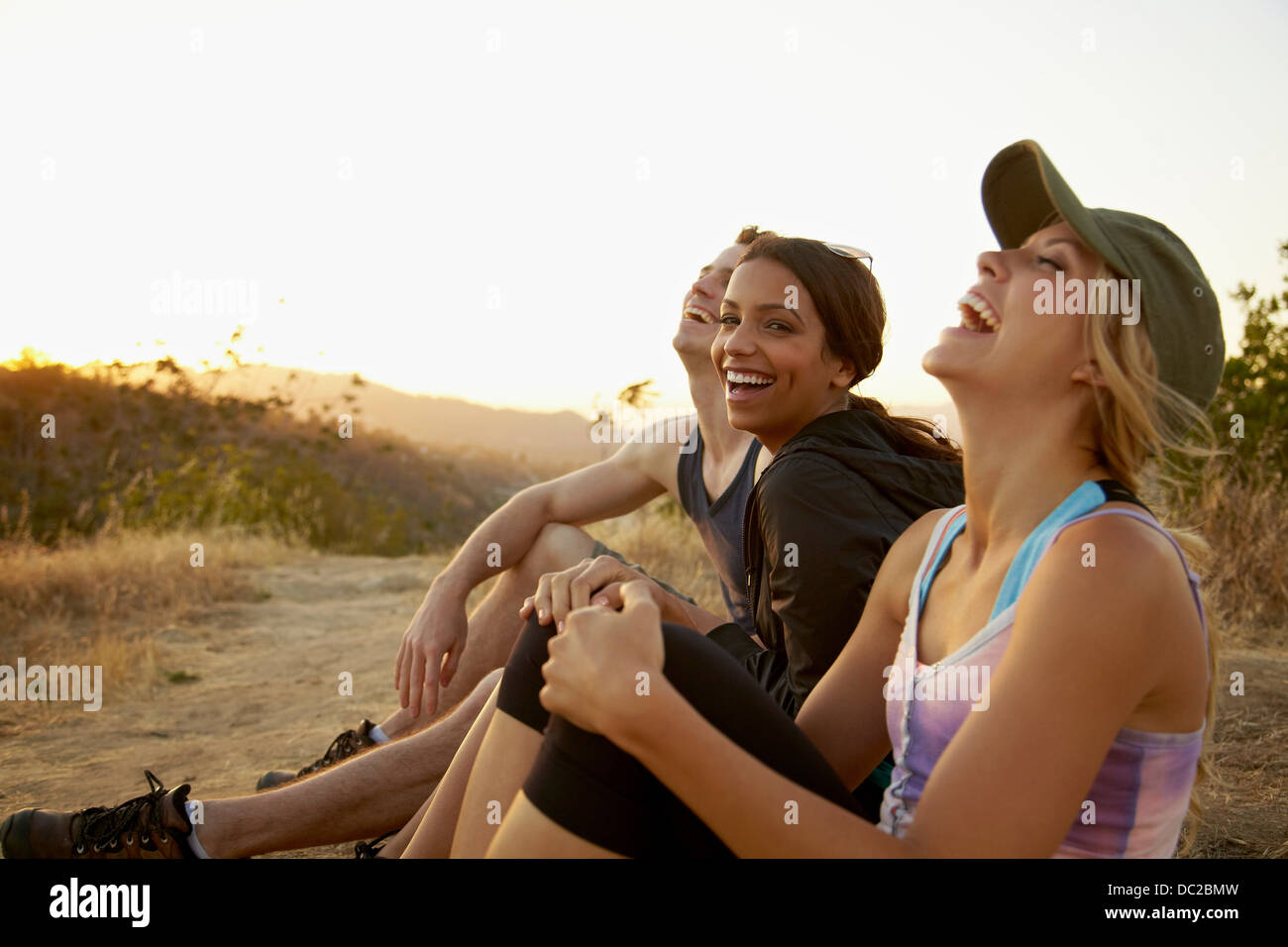 Friends enjoying hillside Stock Photo