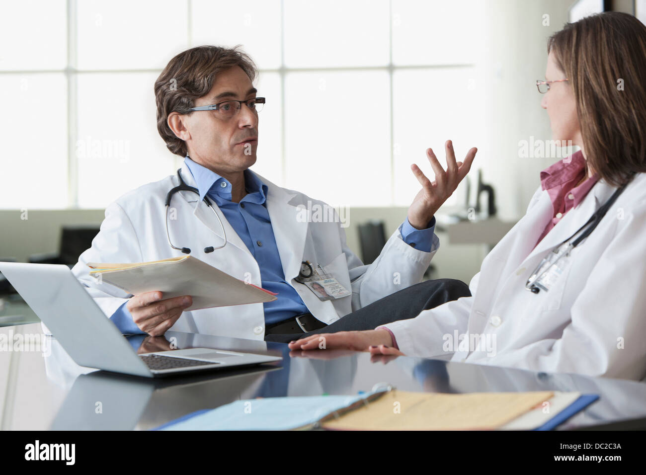 Open Discussion Doctors Two doctors in discussion Stock Photo - Alamy