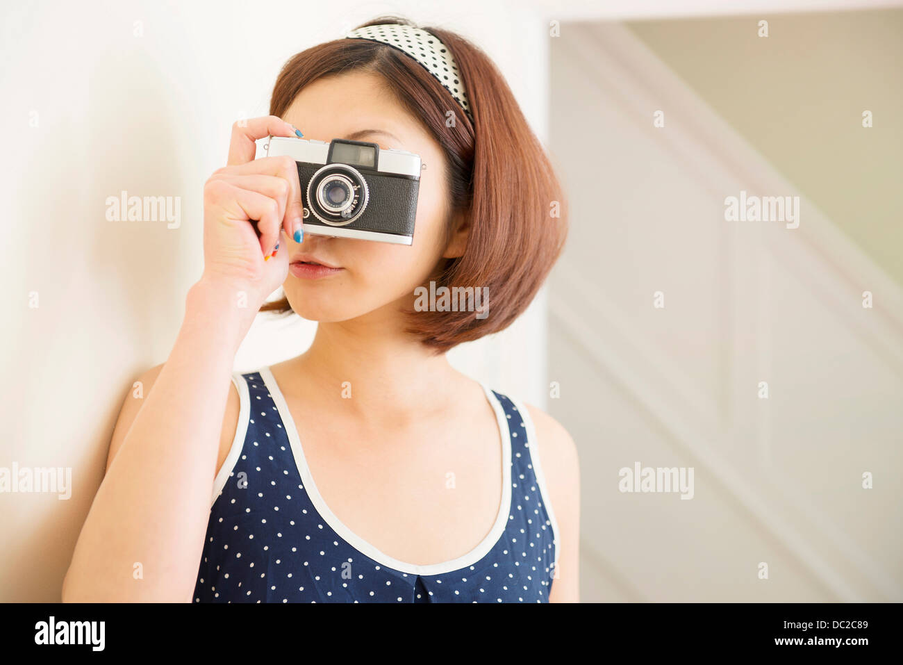 Woman taking photograph Stock Photo
