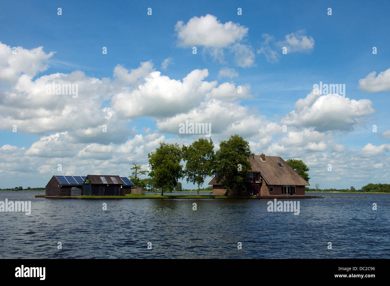 House built on an island Lake Bovenwijde Giethoorn Holland Stock Photo