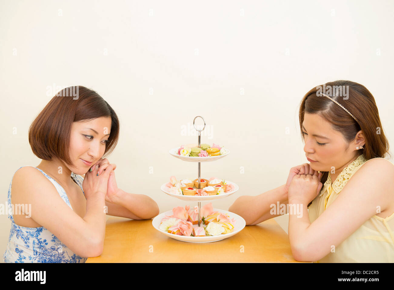 Two women looking at assortment of confectioneries Stock Photo