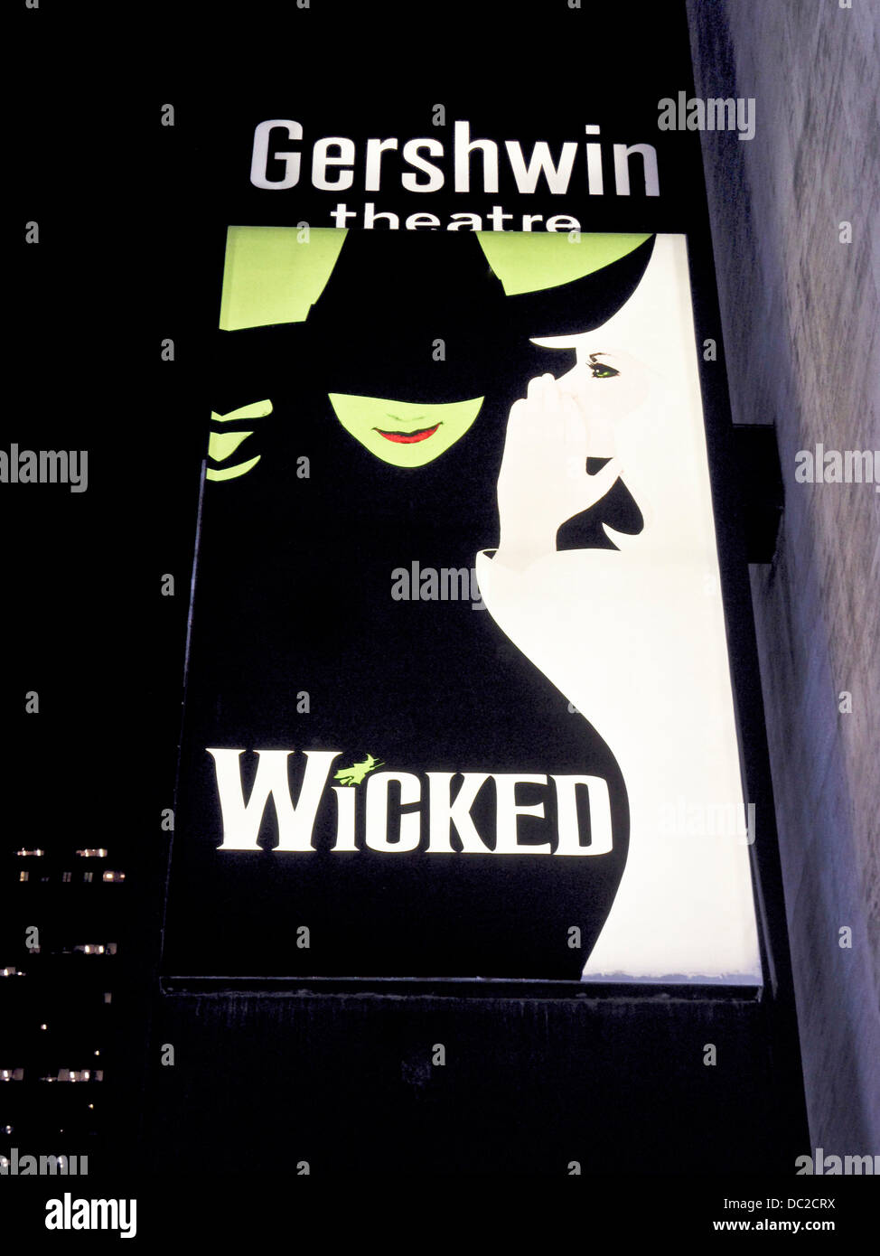 iconic illuminated advertising for long running Broadway show Wicked glows in night outside Gershwin theater theatre Manhattan Stock Photo