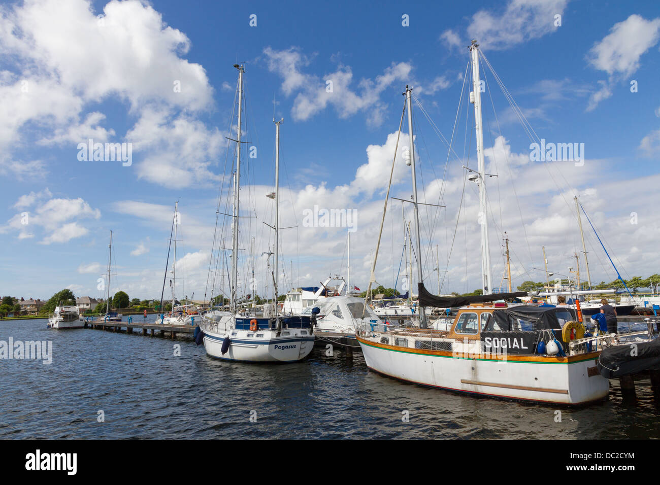 Boats moored along the Jetty at Glasson Basin, Glasson Dock, Lancaster, Lancashire. Stock Photo