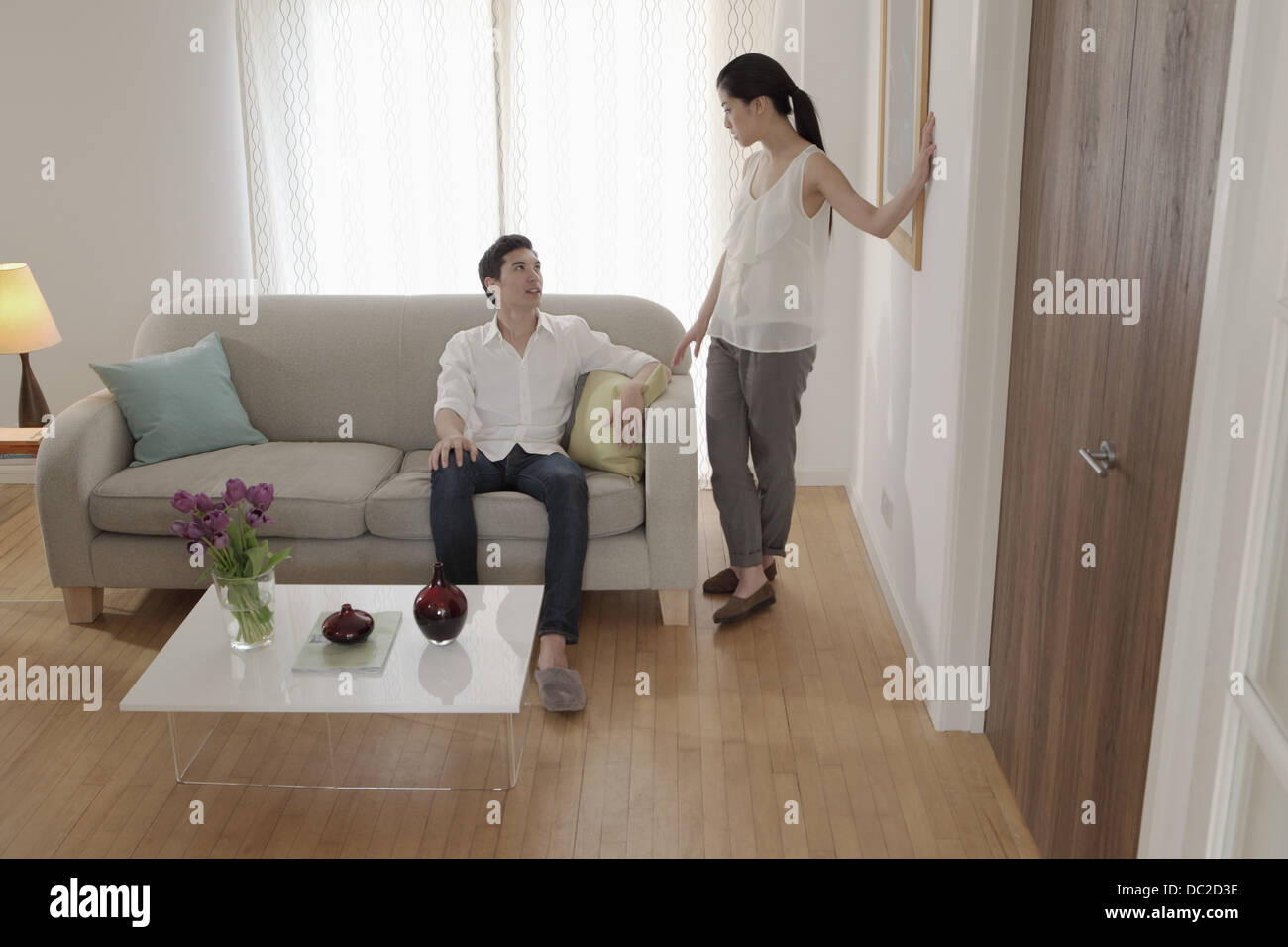 Couple discussing in living room Stock Photo Alamy