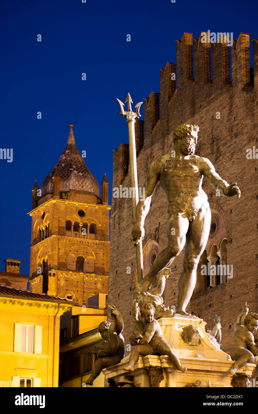 Statue and Fountain of Neptune with Duomo cathedral behind at night / twilight / dusk Bologna Emilia Romagna Italy Stock Photo